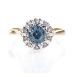 An 18ct gold blue zircon and diamond cluster ring, setting height 8.9mm, size M, 2.9g