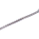 An 18ct white gold diamond tennis line bracelet, total diamond content approx 1ct, length 190mm,