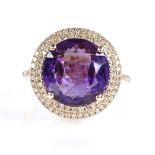 A 14ct gold amethyst and diamond cluster ring, oval-cut amethyst approx 6.47ct, total diamond