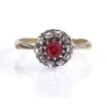 An unmarked gold red stone and diamond chip cluster ring, setting height 9.5mm, size P, 2.8g