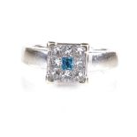 An 18ct white gold blue and white diamond cluster ring, total Princess-cut diamond content approx