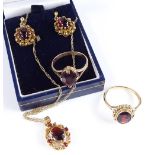 A group of gold garnet set jewellery (4)