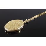 A 9ct gold oval locket pendant, on a 9ct gold curb link chain, chain length 630mm, 14.3g