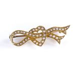 An unmarked gold pearl heart and ribbon design brooch, length 39mm, 4.9g