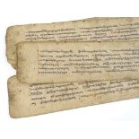 An unbound book of handwritten Middle Eastern text, 17th or 18th century, sheet size 41cm x 8cm
