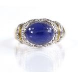 A 9ct gold cabochon iolite diamond cluster ring, setting height 11mm, size Q, 4g