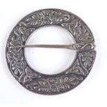 A Scottish silver Iona brooch, embossed floral surround, diameter 51.9mm, 21.2g
