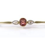 An unmarked gold 3-stone tourmaline and pear-cut diamond bar brooch, tourmaline approx 0.54ct,