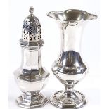 An octagonal silver sugar caster, together with a silver fluted vase, vase height 15cm
