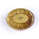 A Victorian unmarked gold oval brooch, with central chip diamond, settings test as 15ct gold, length