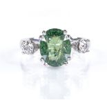 An 18ct white gold 3-stone green garnet and diamond ring, oval-cut garnet approx 4ct, setting
