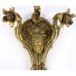 A 19th century French bronze triple light wall sconce, relief cast mask decoration, height approx