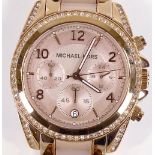 A lady's Michael Kors Quartz wristwatch, rose gold plated and stainless steel case, with 3