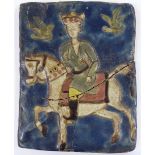 An early relief moulded and painted tile, depicting a King on horseback, possibly Medieval, 18cm x