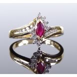 A 14ct gold marquise ruby and diamond cluster ring, setting height 11.9mm, size M, 3.3g