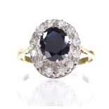 An 18ct gold sapphire and diamond cluster ring, setting height 15.1mm, size U, 5.1g