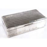 A large rectangular silver cigarette box, with engine turned lid, by Alexander Clark & Co Ltd,