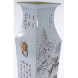 A Chinese porcelain square section vase with painted mountain landscape and text, height 57cm, rim