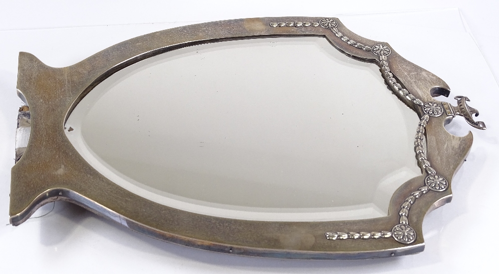 An Edwardian large silver-fronted shield-shaped mirror, with cup finial and silver foliate swags, by - Image 2 of 3