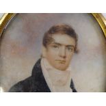 An early 19th century miniature watercolour on ivory, half length portrait of a gentleman, unsigned,