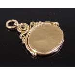 A slim 9ct gold swivel memorial photo locket, length 28.2mm, 6.2g