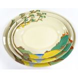 A graduated set of 3 Clarice Cliff Bizarre Red Roof pattern meat plates, largest length 42cm
