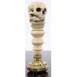 A fine quality 19th century carved ivory memento mori desk seal, with serpent and skull design