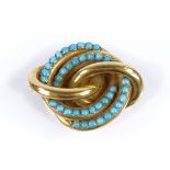 A Victorian unmarked gold turquoise knot brooch, length 40.8mm, 10g