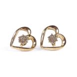 A pair of 9ct gold diamond set heart-shaped earrings, height 16mm, 3.7g