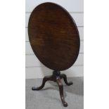 A 19th century mahogany circular tilt-top tea table on tripod base, 2' 7" across