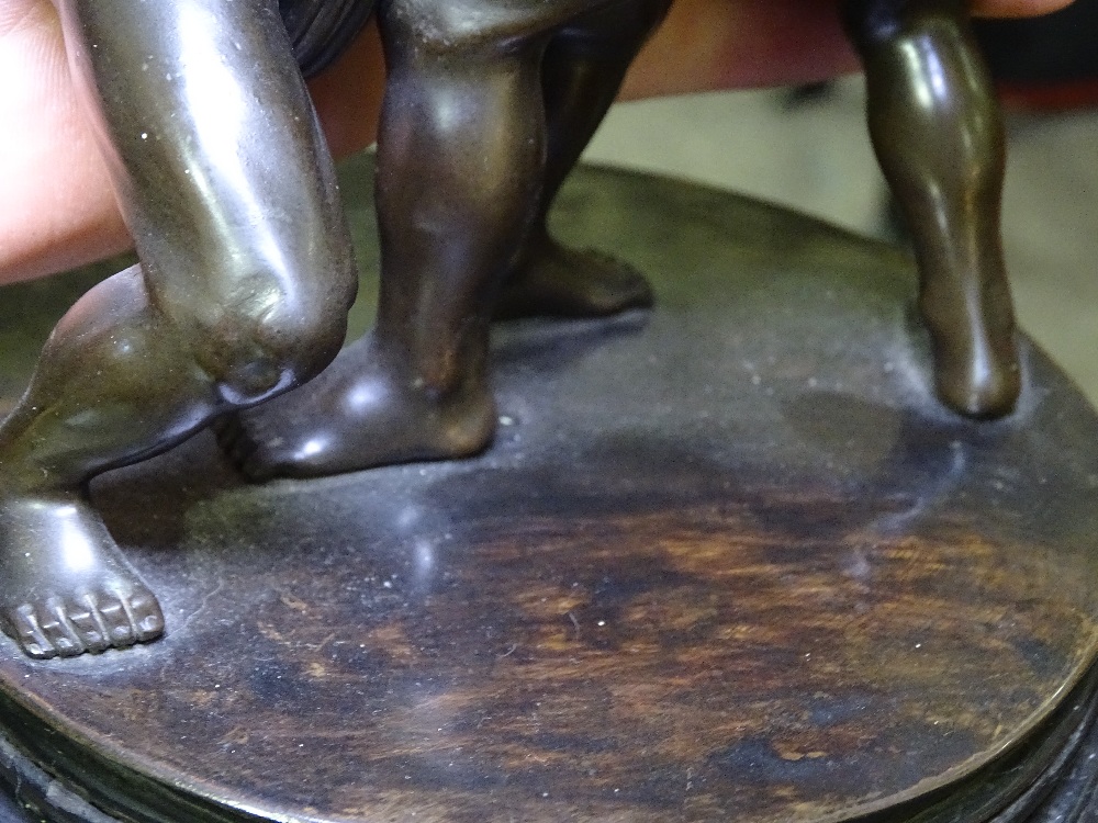 A Japanese bronze Sumo wrestling sculpture, early 20th century, unsigned, on circular ebony stand, - Image 7 of 9