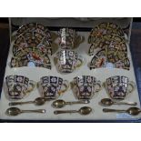 A set of 6 Royal Crown Derby teacups, saucers and teaspoons, with gilded red and blue painted