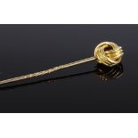 An unmarked gold knot design stickpin, length 65.7mm, 4.1g