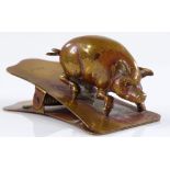 A Victorian brass pig design desk paperclip, length 6cm