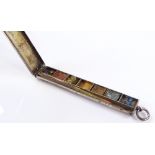 An Edwardian silver novelty miniature watercolour paintbox, of plain oblong form, containing