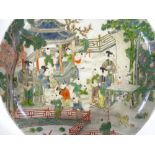 A Chinese porcelain plate with painted village scene, diameter 31cm