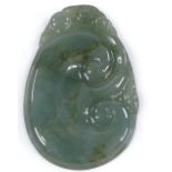 A Chinese relief carved jadeite pendant, height 5cm