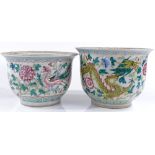 A pair of Chinese porcelain jardinieres, with painted enamel dragons, rim diameter 27cm, height