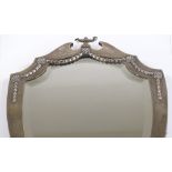 An Edwardian large silver-fronted shield-shaped mirror, with cup finial and silver foliate swags, by