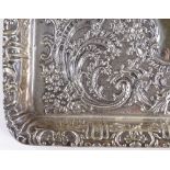 An Edwardian rectangular silver tray, with relief embossed foliate decoration, by Williams (