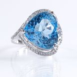 A 14ct white gold blue topaz and diamond cluster ring, heart-shaped topaz approx 12.56ct, total