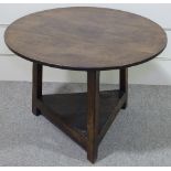 A circular oak cricket table, with triangular under tier, diameter 2' 7"
