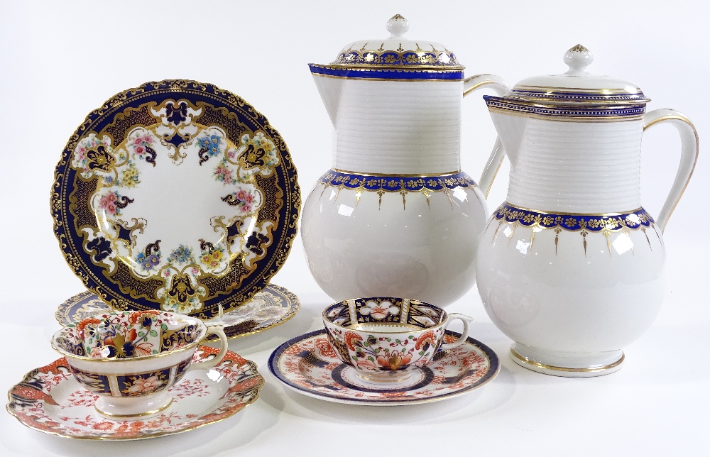 A group of 19th century Derby china, including a graduated pair of blue and gilt lidded jugs,