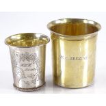 An unmarked silver-gilt beaker, together with a smaller Dutch silver beaker, largest height 8cm, 3.