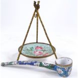 A 19th century gilt-brass pocket watch stand, in the form of a tripod, with porcelain panel,