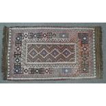 A pink ground Kelim rug with geometric border, 5' x 2' 10"