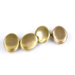 A pair of 15ct gold oval hollow-back cufflinks, panel length 17.3mm, 6.7g