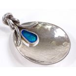 An Arts and Crafts style silver and peacock enamel caddy spoon, with knot design handle, by John