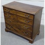 A George III mahogany chest of 4 long graduated drawers of small size, with brass drop handles and