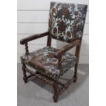 A 19th century Italian carved oak-framed armchair, with embossed leather upholstery